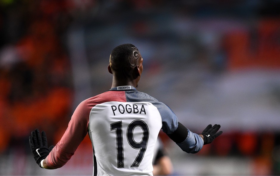 France's midfielder Paul Pogba reacts during the friendly football match between the Netherlands and France at the Amsterdam ArenA, on March 25, 2016, in Amsterdam. / AFP / FRANCK FIFE        (Photo credit should read FRANCK FIFE/AFP/Getty Images)