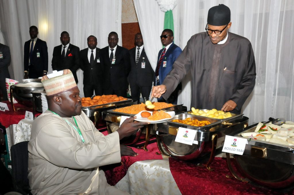 PIC 19.  PRESIDENET MUHAMMADU BUHARI (R) SERVING  FOOD TO THE PRESIDENT PARASOCCER  FEDERATION,  ALHAJI  MUSBAHU  DIDI, DURING BREAKING OF RAMADAN FAST WITH INTERNALLY DISPLACED PERSONS (IDPs),   ARTISANS AND OTHER NIGERIANS AT THE PRESIDENTIAL VILLA ABUJA ON MONDAY (4/7/16) 4820/04/07/16/ICE/NAN