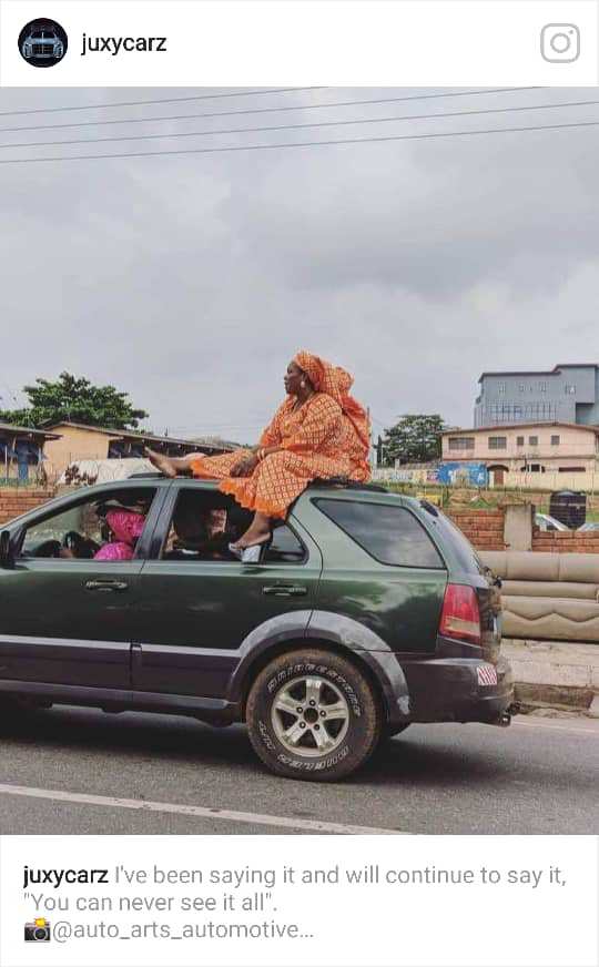 A Mobile SUV With A Woman On Top Of It Spotted On The Road (Photo)